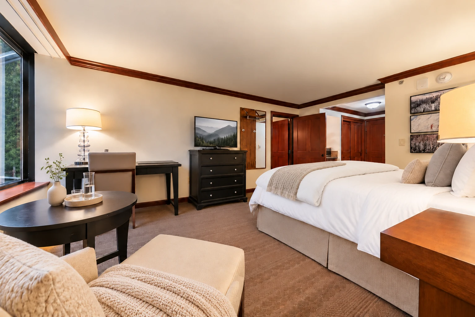 King room — King room & sitting area; digitally styled linens and accessories