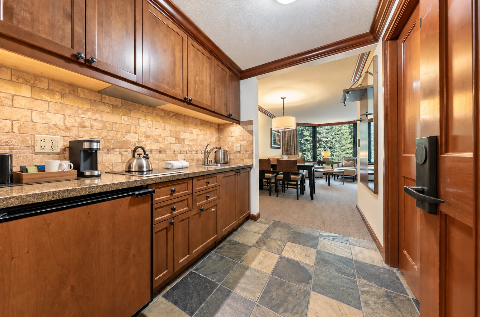 One-bedroom suite — Kitchenette; digitally styled linens and accessories